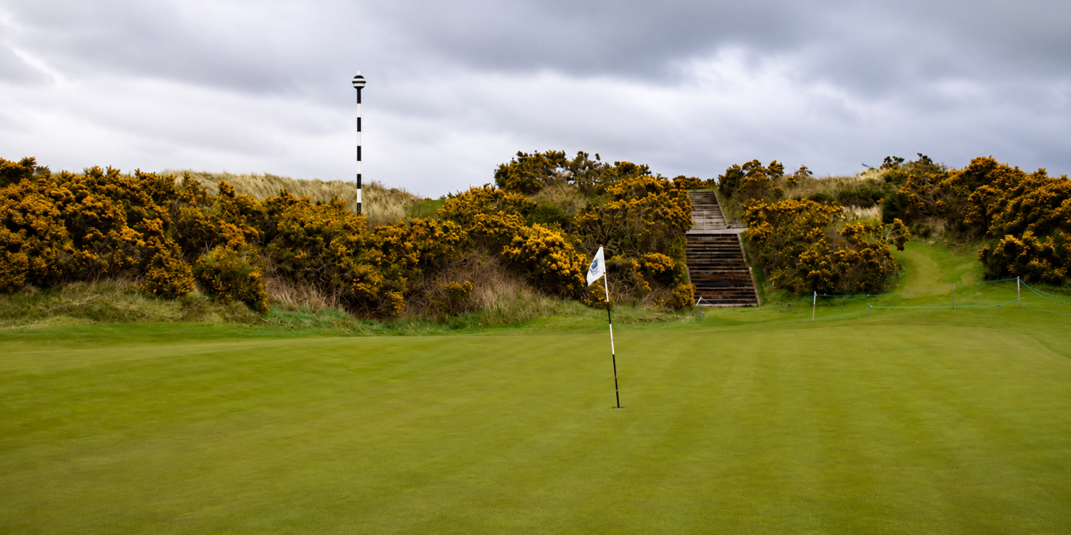 Hole 13, Royal County Down. The pole is where you aim on your approach. Hole 13, Royal County Down. The pole is where you aim on your approach.